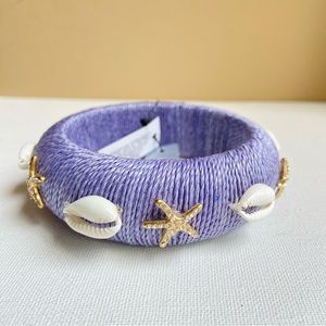Chico’s beachy blue bangle bracelet with faux shells and rhinestone starfish